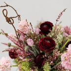 Close-up of Blush Nocturne showing burgundy ranunculus, soft blush pink blooms, delicate filler flowers and greenery.